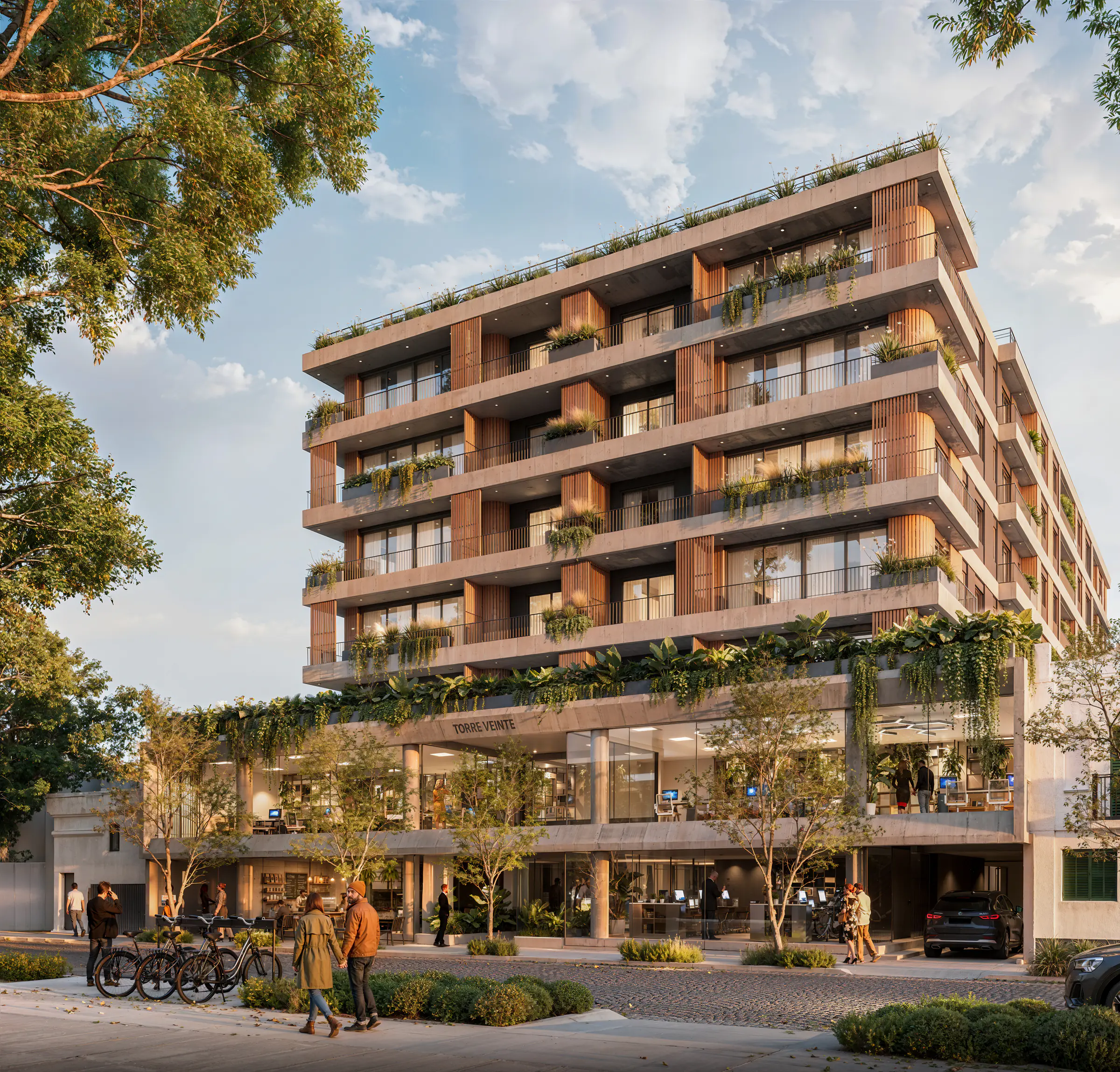 Torre Veinte vista en perspectiva desde la vereda: balcones corridos de hormigón con listones de madera y plantas colgantes, oficinas vidriadas en el primer piso, bicicletas estacionadas y peatones en la vereda de una calle adoquinada
